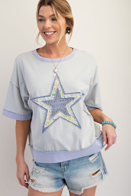 Blue top with stud star and floral outline