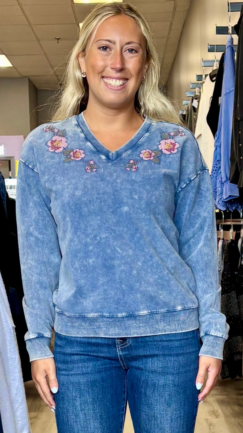 Charlie B blue v neck sweatshirt with multicolored embroidered flowers