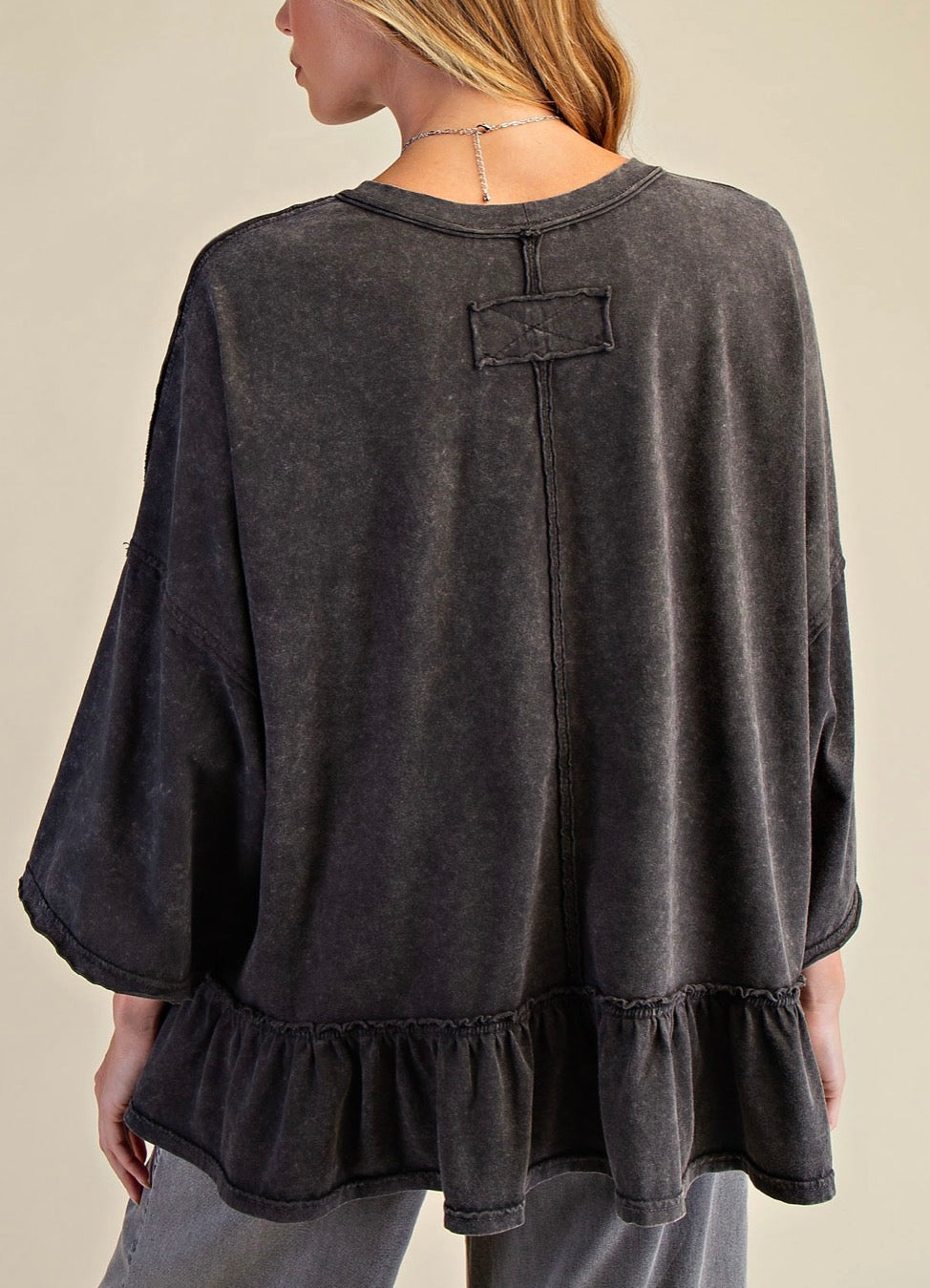PREORDER NOW, Arriving Monday…Mineral wash black loose fit top with elbow length sleeves and flounce bottom