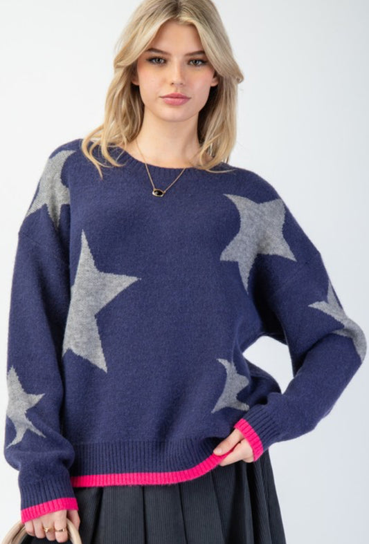 Navy loose fit sweater with white stars and pink trim