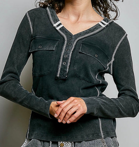 Black henley with white trim and 2 front pockets