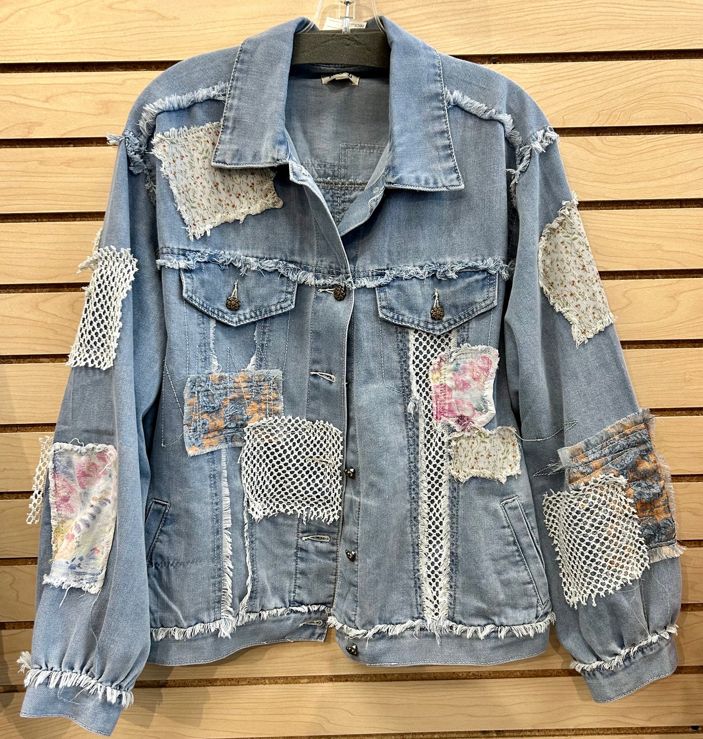 Denim jacket with netting and patches all over