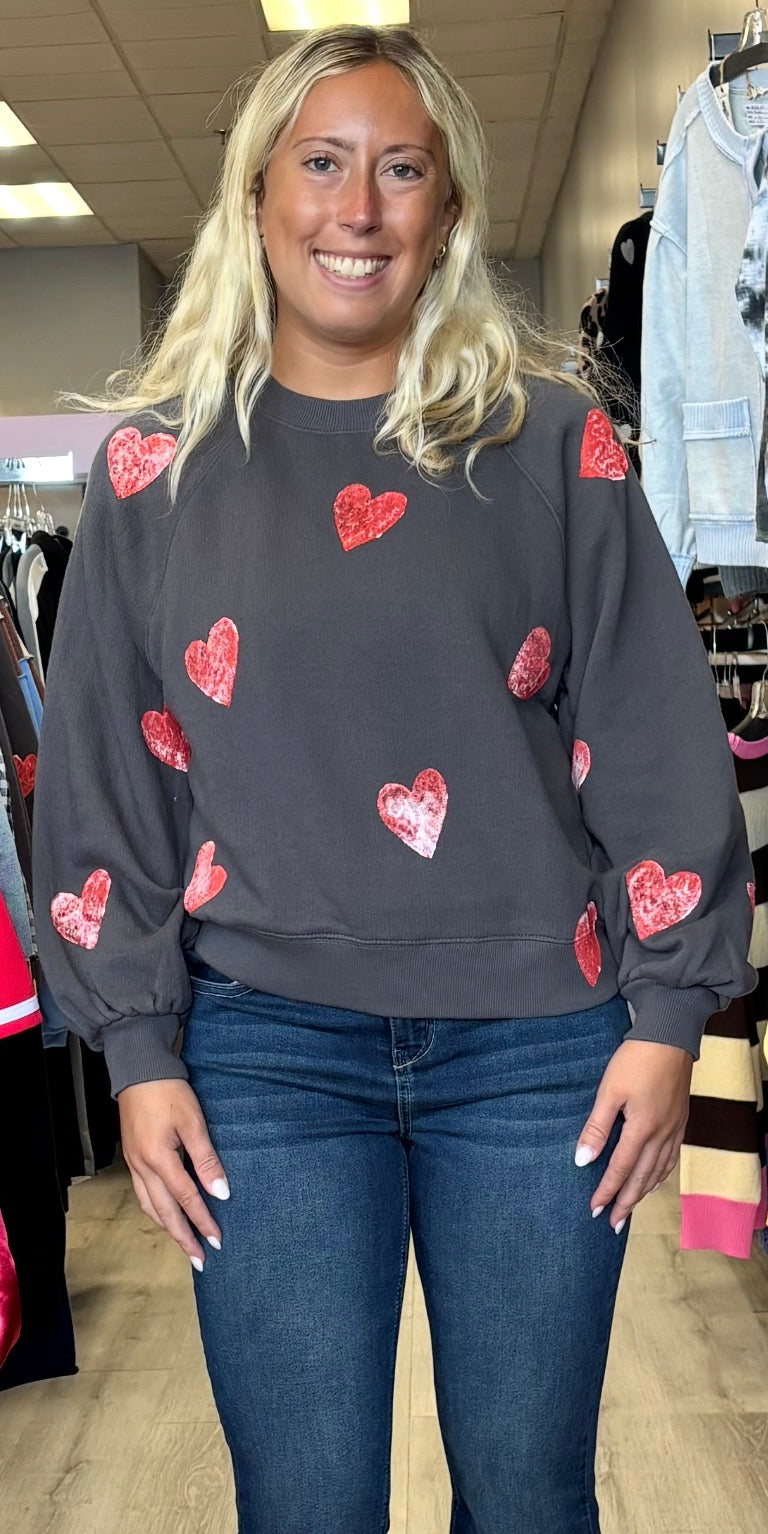 Charcoal grey sweatshirt with pink hearts all over