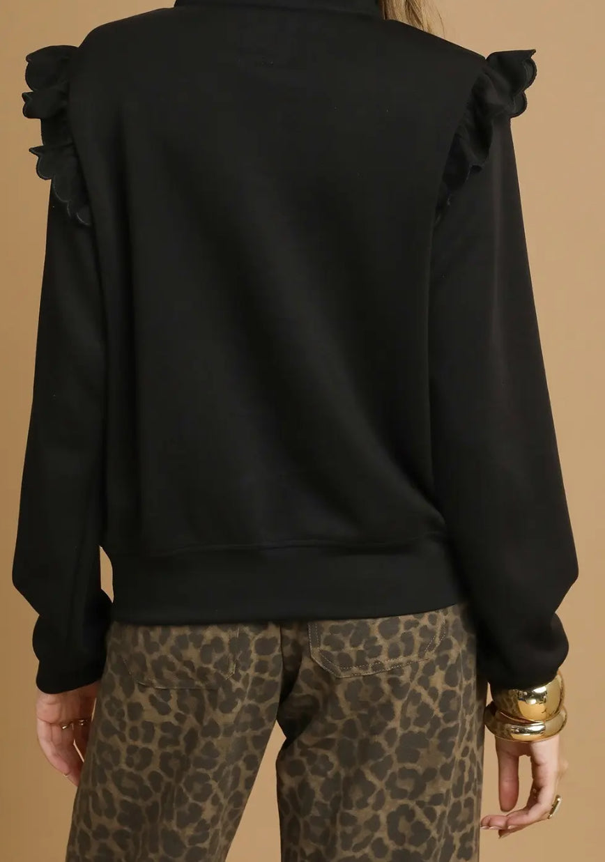 Black scuba ruffle knit quarter zip sweatshirt with gold zipper