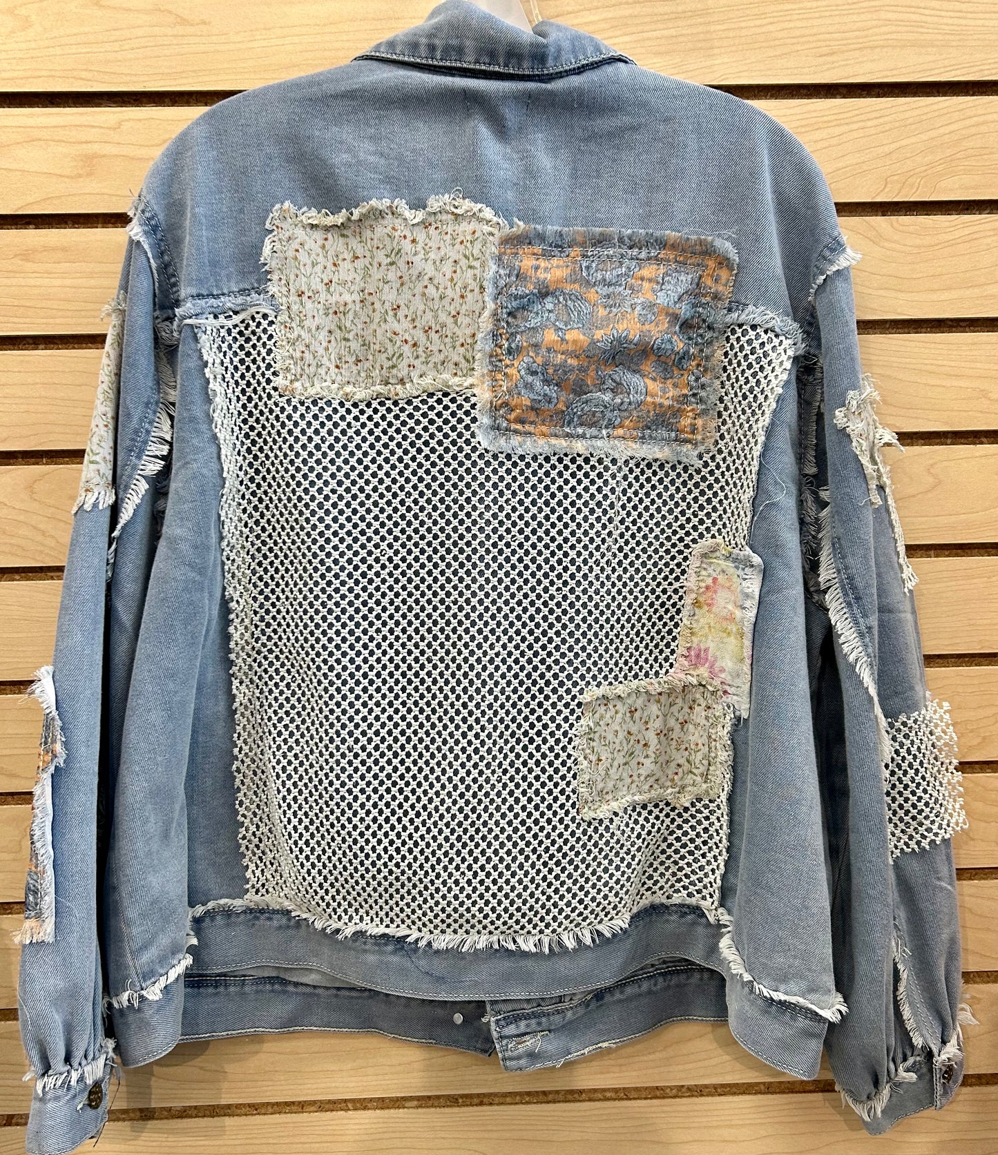 Denim jacket with netting and patches all over