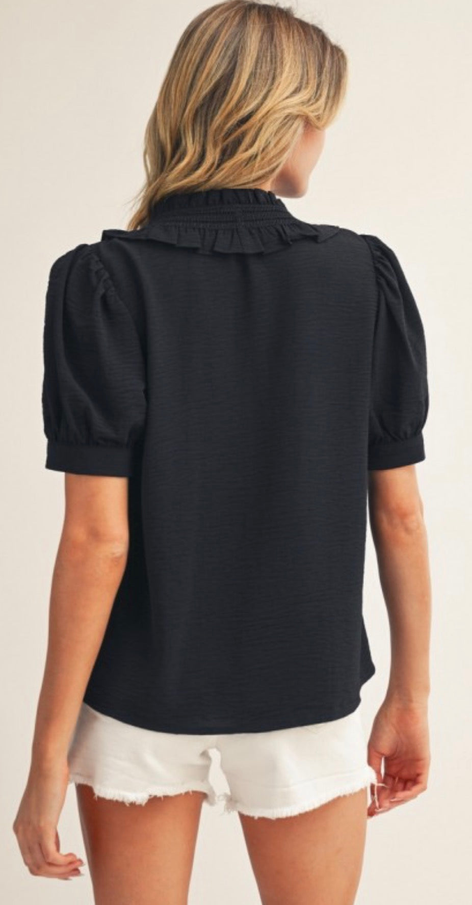 Black soft, lightweight button down top with ruffle detail